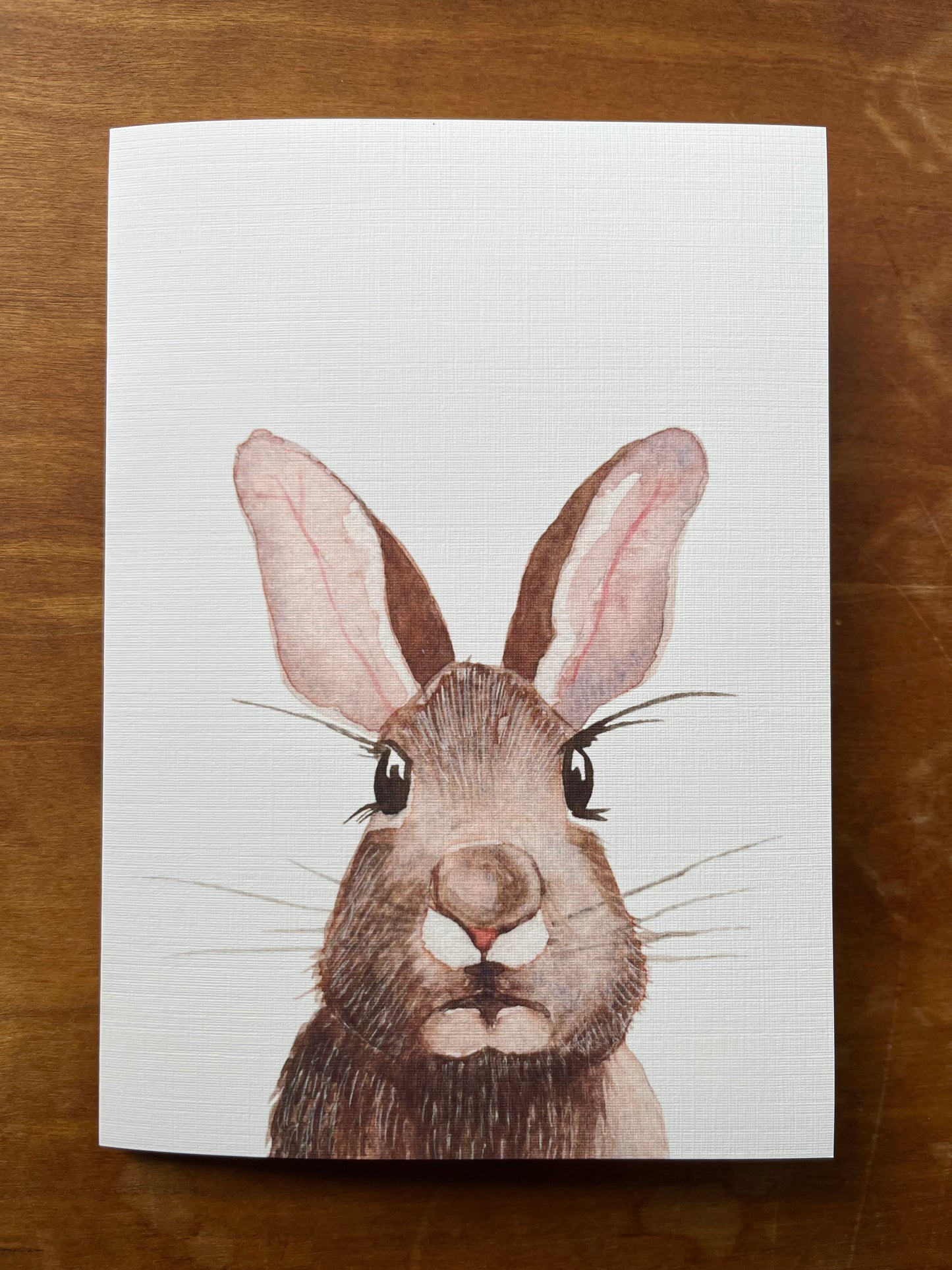 Greeting card with a watercolor painting of a rabbit.
