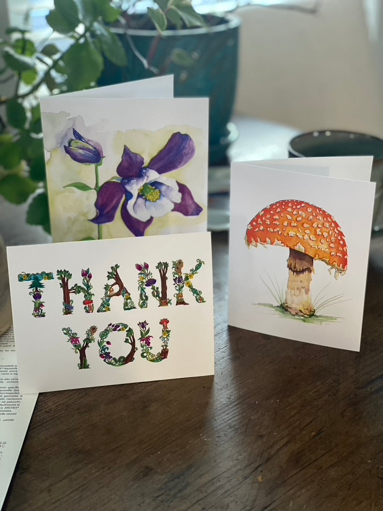 collection of three greeting cards including one with a watercolor painting of an orange mushroom. 