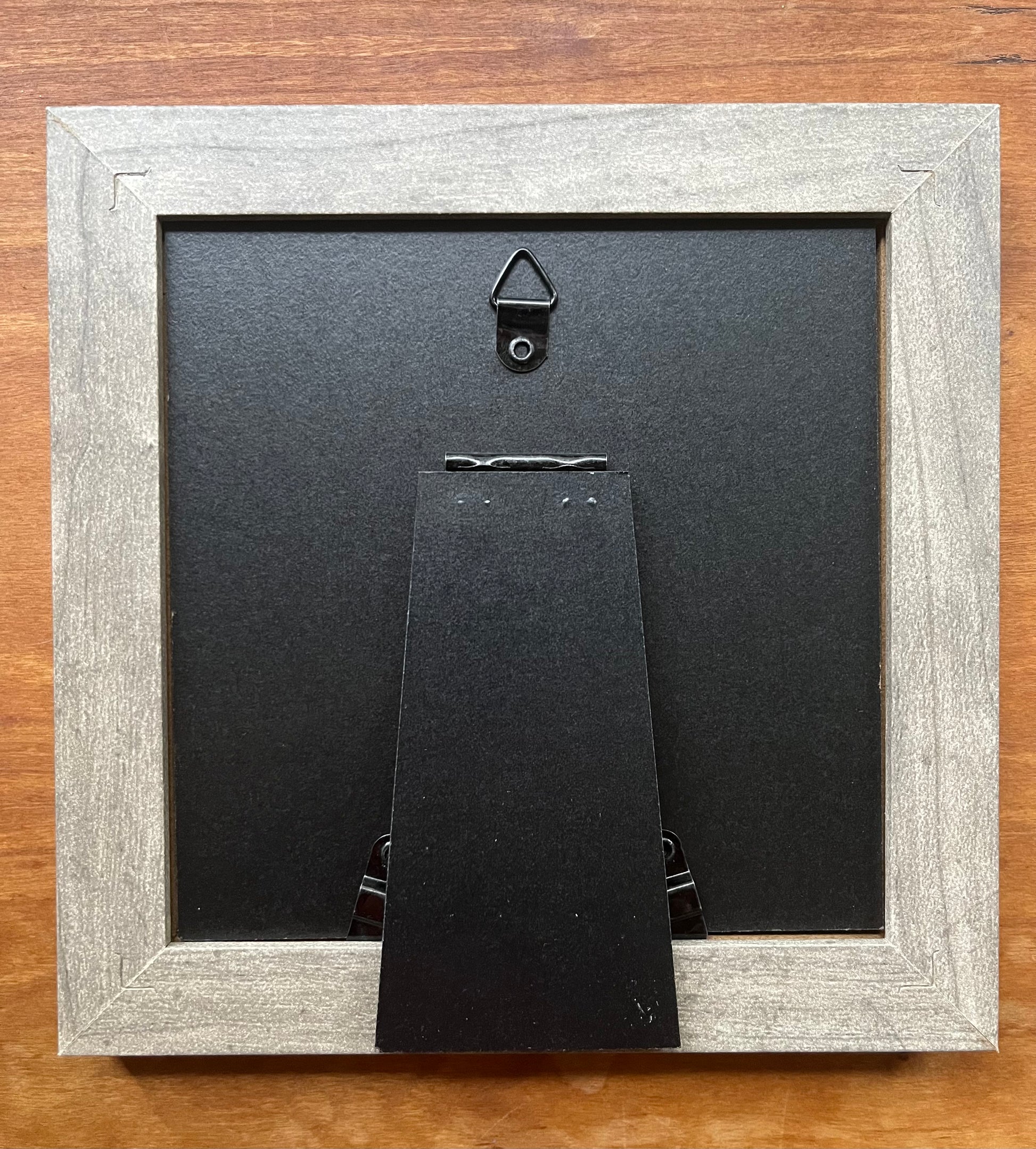 Back view of a square grey picture frame