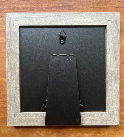 Back view of a square grey picture frame