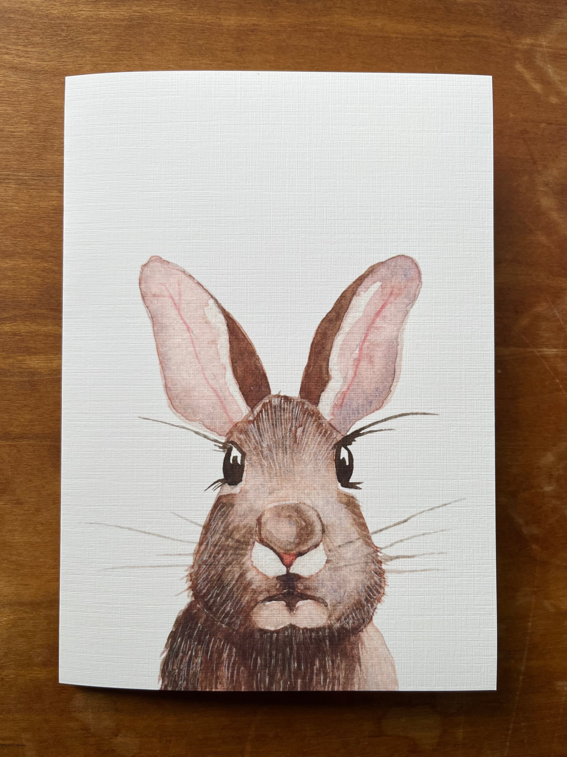Greeting card with a watercolor painting of a rabbit. 