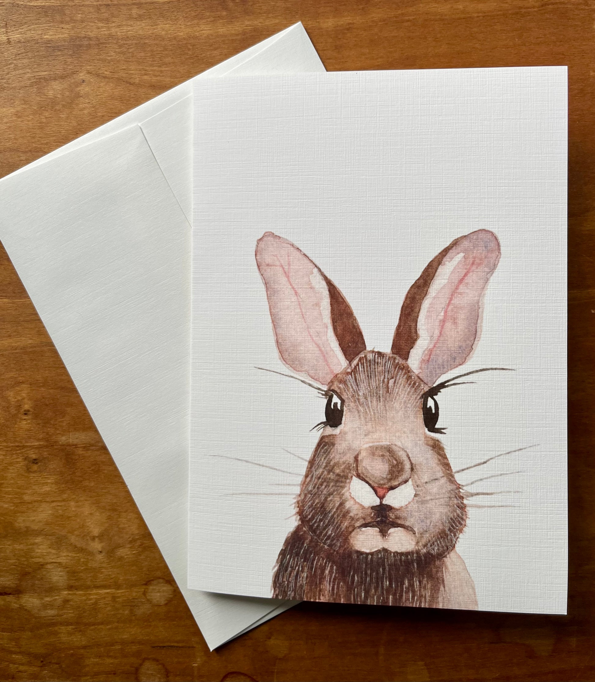 Greeting card with a watercolor painting of a rabbit.