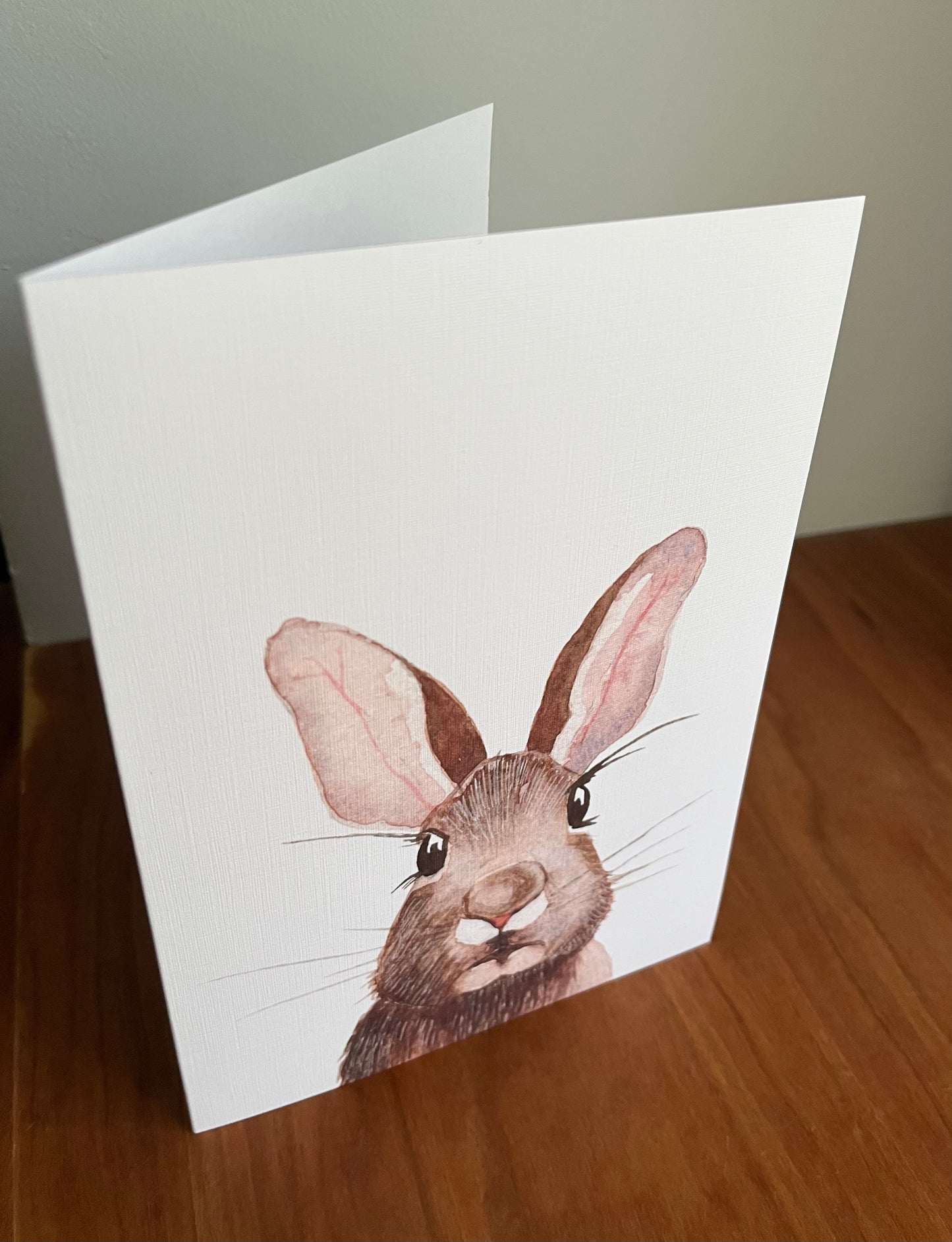 Greeting card with a watercolor painting of a rabbit. 