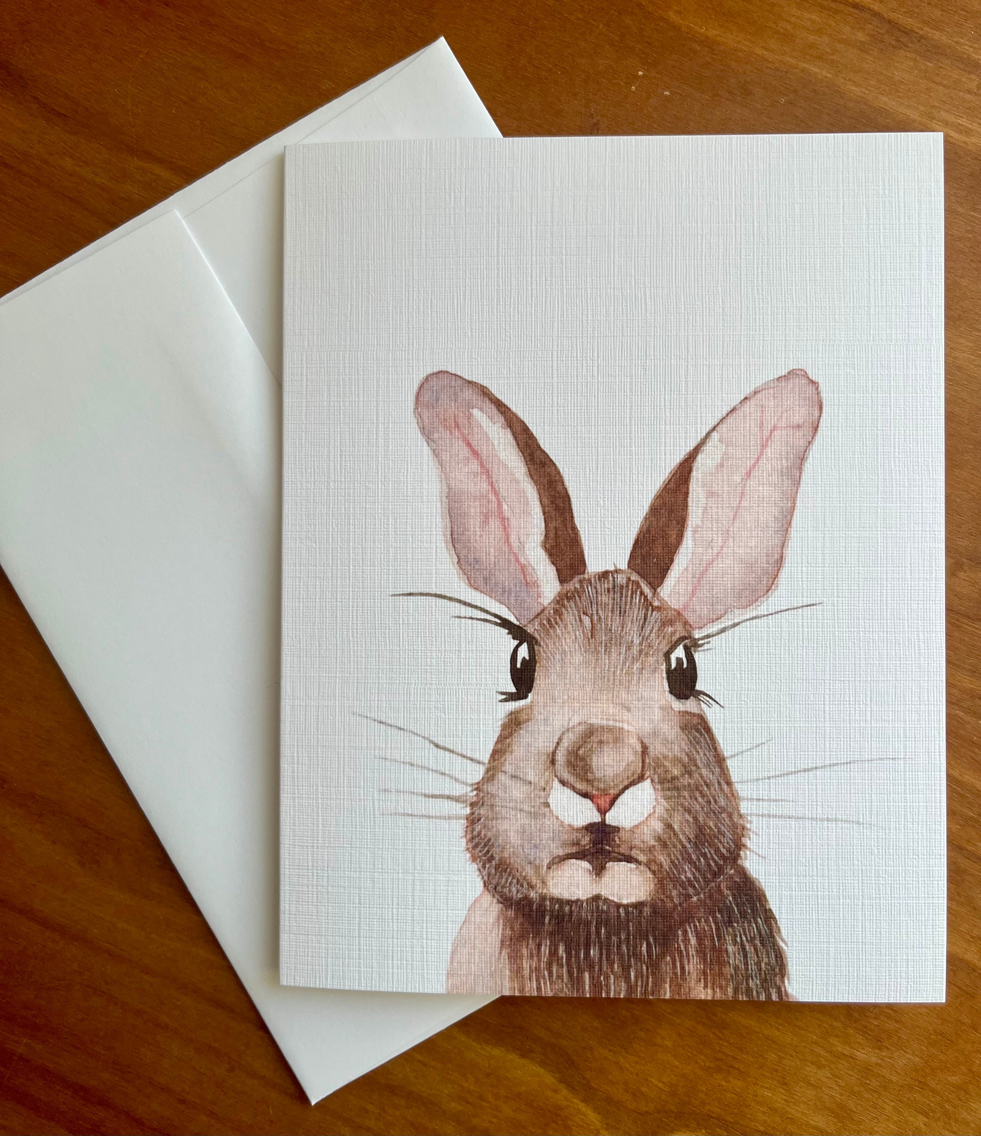 Greeting card with a watercolor painting of a rabbit.