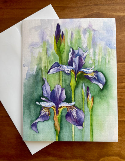 Greeting card with a watercolor painting of irises along with a white envelope. 