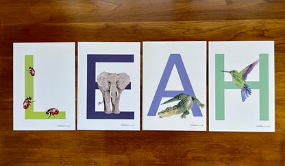 Alphabet letters with watercolor animals for each letter spelling out the name Leah.