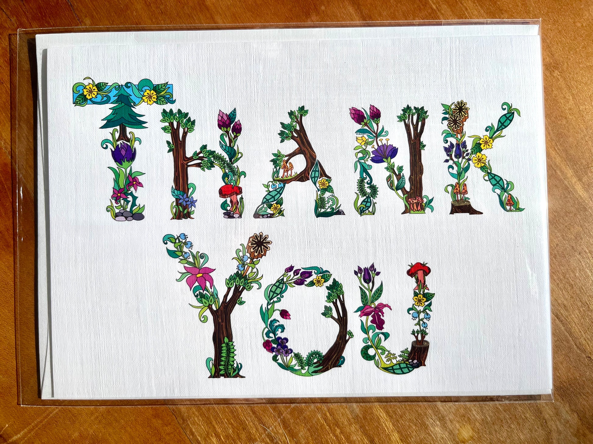 5x7 greeting card with botanical letters spelling out the words thank you. 