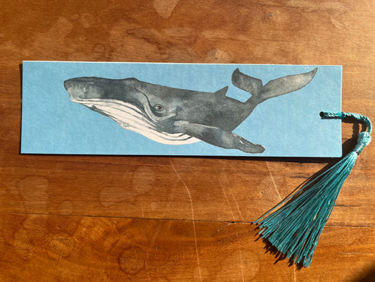 bookmark with a watercolor whale and a blue tassel.