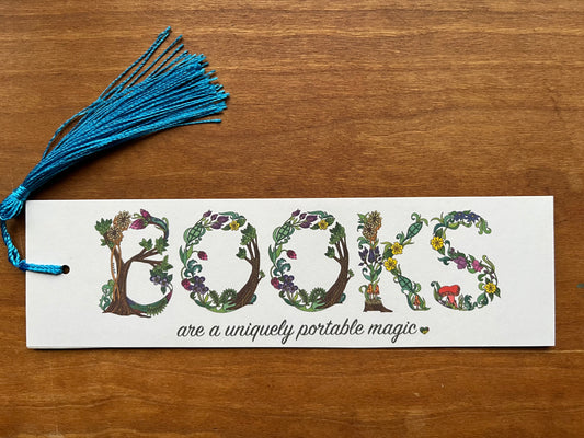 bookmark with botanical text that says, "books are a uniquely portable magic".