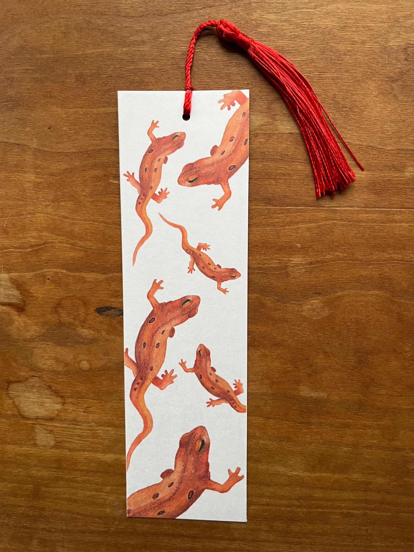 a bookmark with watercolor newts on it.