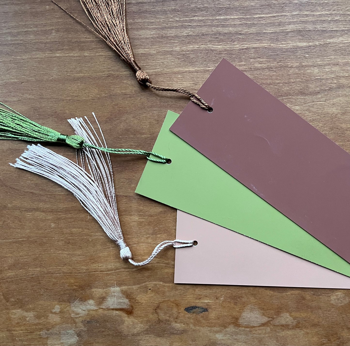 three bookmarks with tassels.