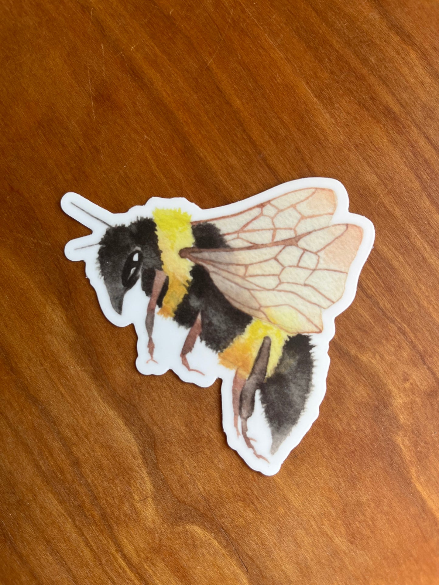 sticker of a watercolor bumblebee.